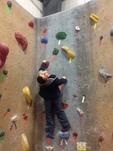 Pete Stathatos on climbing wall